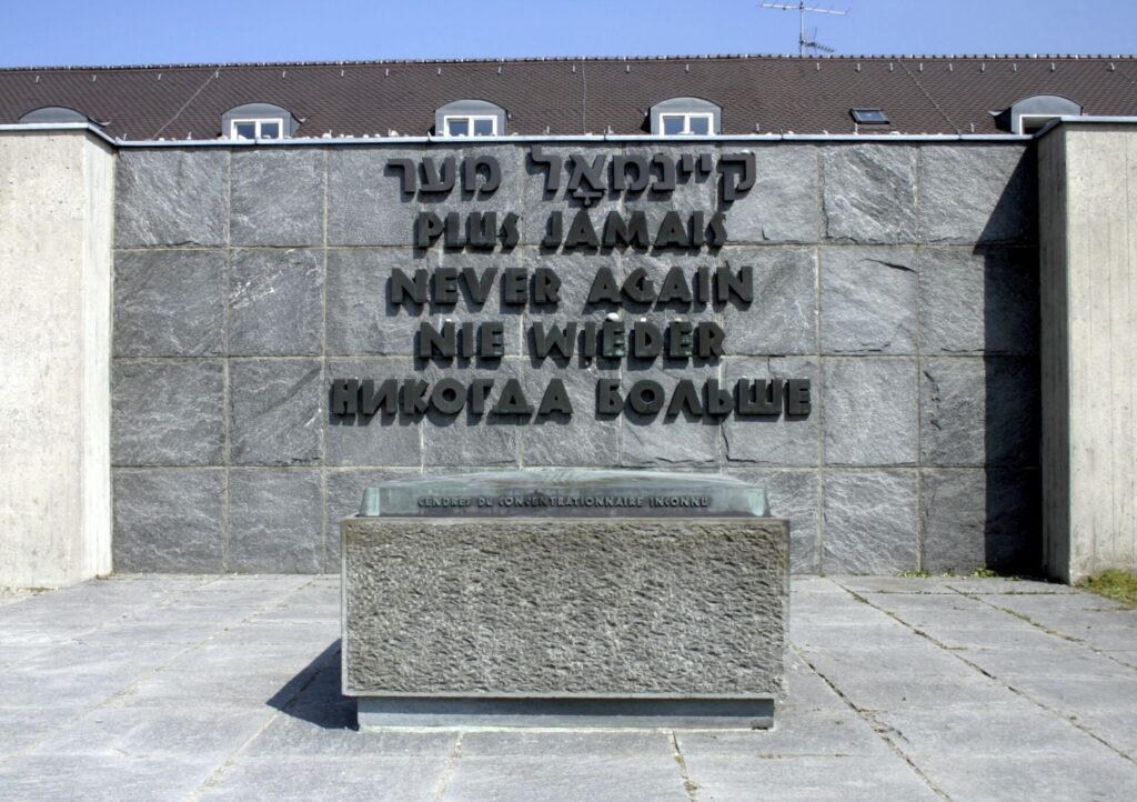 A memorial at Dachau with the words 'Never Again' in Hebrew, French, English, German, and Russian